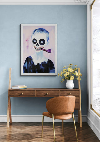 Framed "My Pipe - Martin Zen" artwork featuring a skull-faced figure with a pipe, displayed above a desk.