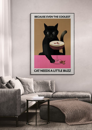 Framed wallchart of a black cat with espresso on a table, displayed above a modern living room sofa.
