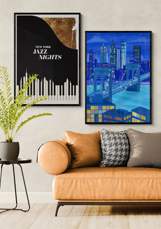 Framed print of New York skyline at night by Petra Lizde displayed above a modern tan sofa.