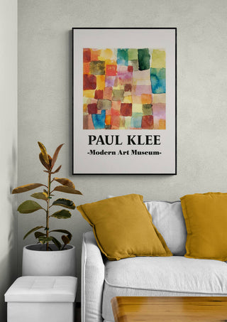Framed print of Paul Klee’s "Untitled 1914" with colorful abstract squares, displayed above a modern sofa.