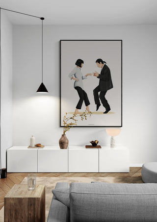Minimalist living room featuring a framed "Pulp Fiction - Nour Tohme" artwork above a white sideboard.