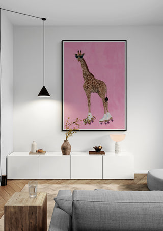 Framed Rollerskating Giraffe art by Sarah Manovski hanging on a pink wall in a modern living room setting.