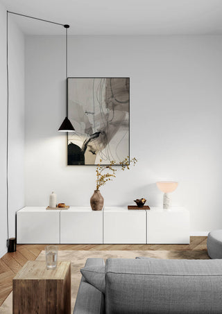 Fragments of Time artwork displayed above a modern white sideboard in a minimalist living room setting.