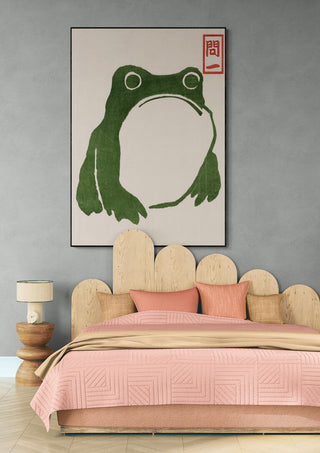 Grumpy Toad II by Matsumoto Hoji art print displayed above a bed in a modern, stylish bedroom.