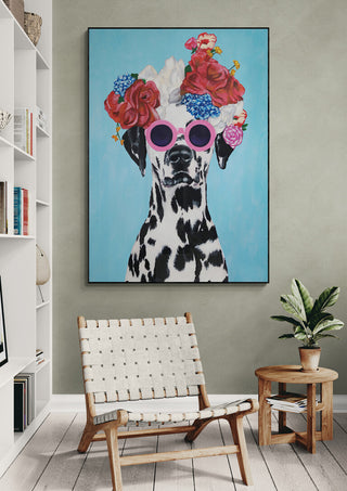 Art print of a Dalmatian wearing pink sunglasses and a floral crown, displayed in a modern living room.