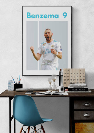 Poster of Benzema celebrating in a Real Madrid kit with "Benzema 9" text, displayed above a modern desk setup.
