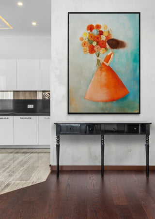 Framed artwork "I can buy myself flowers" by Annika Persson hanging above a black console table in a modern room.