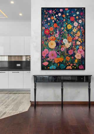 Summer Dreams by Annika Persson, a vibrant floral art piece, hangs above a black console table in a modern room.